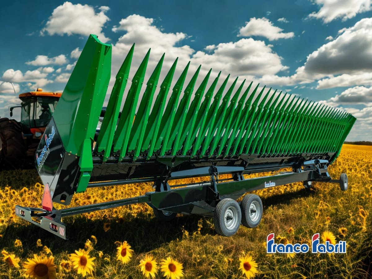 Cabezal girasolero Franco Fabril convencional verde sobre su carro en un campo de girasol